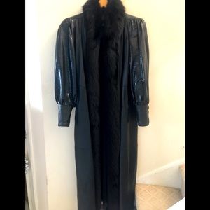 Leather coat with fox trim .  by Rocco of New York